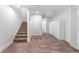 Finished basement with plush carpeting, access to storage, and bright lighting at 5471 S Sherman St, Littleton, CO 80121