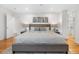 Spacious bedroom with hardwood floors, natural light, and neutral decor at 5471 S Sherman St, Littleton, CO 80121