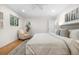Bright bedroom with natural light, hardwood floors, and a cozy seating area at 5471 S Sherman St, Littleton, CO 80121