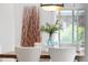Close up on dining room showing table setting, flower arrangement and natural light at 5471 S Sherman St, Littleton, CO 80121