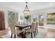 Dining room with natural light, table with seating, and easy access to backyard patio at 5471 S Sherman St, Littleton, CO 80121