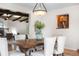 Dining room with wood table, seating for six, and view to the living room fireplace at 5471 S Sherman St, Littleton, CO 80121