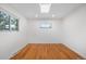 Bright, sunlit room featuring hardwood floors and a skylight, ready for customization at 5471 S Sherman St, Littleton, CO 80121