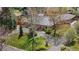 Aerial view of ranch-style home featuring mature landscaping, a circular driveway, and a well-maintained yard at 5471 S Sherman St, Littleton, CO 80121