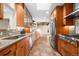 Spacious kitchen with wood cabinets, stainless steel appliances, and bright, natural light at 5471 S Sherman St, Littleton, CO 80121