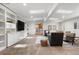 Bright living room with built-in shelving, skylights and comfortable seating arrangement at 5471 S Sherman St, Littleton, CO 80121