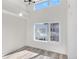Bedroom with high ceilings, light wood floors and window offering views of neighborhood at 1308 Snowberry Ln # 304, Louisville, CO 80027