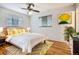 Bright bedroom with hardwood floors, modern decor and a ceiling fan at 3693 E Costilla Ave, Centennial, CO 80122