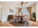Charming dining room with hardwood floors, elegant furniture, and natural light, perfect for gatherings at 3693 E Costilla Ave, Centennial, CO 80122