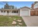 Inviting single-story home featuring a well-kept front yard, driveway, and attached garage at 3693 E Costilla Ave, Centennial, CO 80122