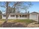 Charming white brick home with a well-maintained lawn and attached two-car garage at 3693 E Costilla Ave, Centennial, CO 80122