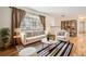 Welcoming living room featuring hardwood floors, lots of natural light and modern furniture at 3693 E Costilla Ave, Centennial, CO 80122