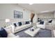 Stylish living room with modern furnishings, a cozy seating area, and a glass-top table at 3693 E Costilla Ave, Centennial, CO 80122