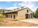 Charming barn with multiple stalls and a spacious garage, offering ample space for storage or hobbies at 6729 Bear Point Trl, Golden, CO 80403