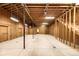 Spacious unfinished basement with exposed beams, perfect for customizing into a recreational space or additional storage at 6729 Bear Point Trl, Golden, CO 80403