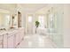 Bright bathroom with double vanity, soaking tub and glass enclosed shower at 6729 Bear Point Trl, Golden, CO 80403