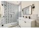 Modern bathroom features a glass-enclosed shower and dual vanity with designer tile work at 6729 Bear Point Trl, Golden, CO 80403