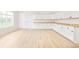 Bright bonus room with wooden floors, cabinets and a large window for ample natural light at 6729 Bear Point Trl, Golden, CO 80403