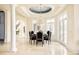 Elegant dining room featuring a chandelier, high ceilings, and sophisticated furnishings at 6729 Bear Point Trl, Golden, CO 80403