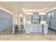 Spacious kitchen featuring custom cabinetry, a large island, and high-end finishes at 6729 Bear Point Trl, Golden, CO 80403