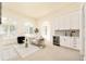 Bright living room with a bar area, stylish furniture, and beautiful arched windows at 6729 Bear Point Trl, Golden, CO 80403