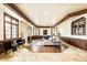 Spacious living room with a fireplace, wood floors, and elegant trim work at 6729 Bear Point Trl, Golden, CO 80403