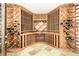 Custom designed wine cellar featuring floor to ceiling storage racks at 6729 Bear Point Trl, Golden, CO 80403