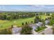 Aerial view of neighborhood with lush landscaping and golf course at 8397 Chase Dr, Arvada, CO 80003