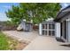 Paver patio highlights the backyard with a storage shed and sunroom at 8397 Chase Dr, Arvada, CO 80003