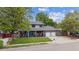 Charming two-story home with covered front porch and mature trees at 8397 Chase Dr, Arvada, CO 80003