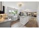 Charming kitchen featuring an island and view into the main living area and fireplace at 8397 Chase Dr, Arvada, CO 80003