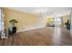 Spacious living room with sleek hardwood floors, large windows, and contemporary lighting at 8397 Chase Dr, Arvada, CO 80003