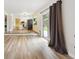 Bright living room with an open floor plan and sliding doors to backyard at 8397 Chase Dr, Arvada, CO 80003