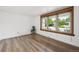 Bright and airy living room with hardwood floors and large windows at 8397 Chase Dr, Arvada, CO 80003