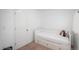 Bright bedroom features white walls, carpeted floors, and a cozy daybed with built in drawers under the bed at 3629 W Custer Pl, Denver, CO 80219
