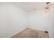 Minimalist bedroom with neutral carpet and paint, recessed lighting, and a pendant lamp at 3629 W Custer Pl, Denver, CO 80219