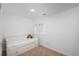 Bright bedroom features white walls, carpeted floors, and a cozy daybed with built in drawers under the bed at 3629 W Custer Pl, Denver, CO 80219