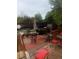 Outdoor patio area with barbecue grill, seating and tiki bar for entertaining guests at 1676 S Fairplay St, Aurora, CO 80012