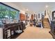Open basement featuring plush carpeting, recessed lighting, and walls adorned with decorative artwork at 1676 S Fairplay St, Aurora, CO 80012