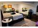 Bedroom with a bed, carpet, and dressers at 1676 S Fairplay St, Aurora, CO 80012