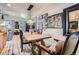 Dining room with modern light fixture and view into living space at 1676 S Fairplay St, Aurora, CO 80012