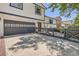 Charming two-story home showcasing a driveway and inviting front entrance with a well-manicured lawn at 1676 S Fairplay St, Aurora, CO 80012