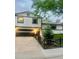 Charming two-story home with a black garage door and well-maintained front yard at 1676 S Fairplay St, Aurora, CO 80012