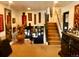 Spacious foyer with carpet, complemented by a staircase, and tasteful décor at 1676 S Fairplay St, Aurora, CO 80012