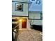 Inviting entryway with a brick path leading to a beautiful stained wood front door at 1676 S Fairplay St, Aurora, CO 80012