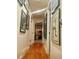 Hallway with wood floors and decorated walls at 1676 S Fairplay St, Aurora, CO 80012