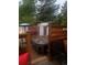 Outdoor hot tub, set within a wooden deck, perfect for relaxation and privacy at 1676 S Fairplay St, Aurora, CO 80012