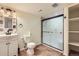 Cozy bathroom featuring a glass shower door, vanity, and tiled floor at 433 N 15Th Ave, Brighton, CO 80601