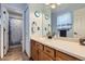 Bright bathroom features oak cabinets, a spacious vanity, and a convenient shower and toilet area at 433 N 15Th Ave, Brighton, CO 80601