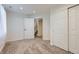Bedroom with neutral carpet, white walls, and closet with doors at 433 N 15Th Ave, Brighton, CO 80601